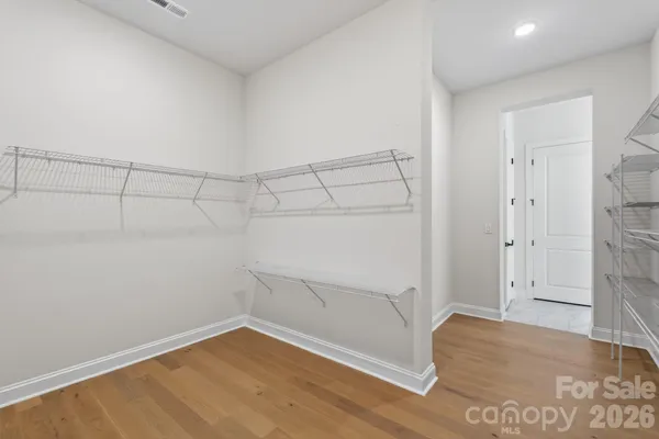 a view of a room with racks on the wall