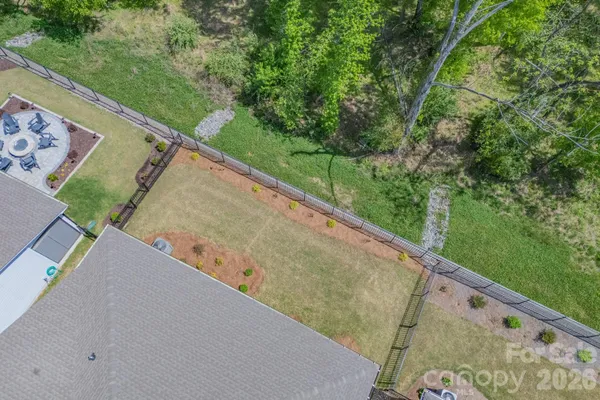 an aerial view of a house with a garden