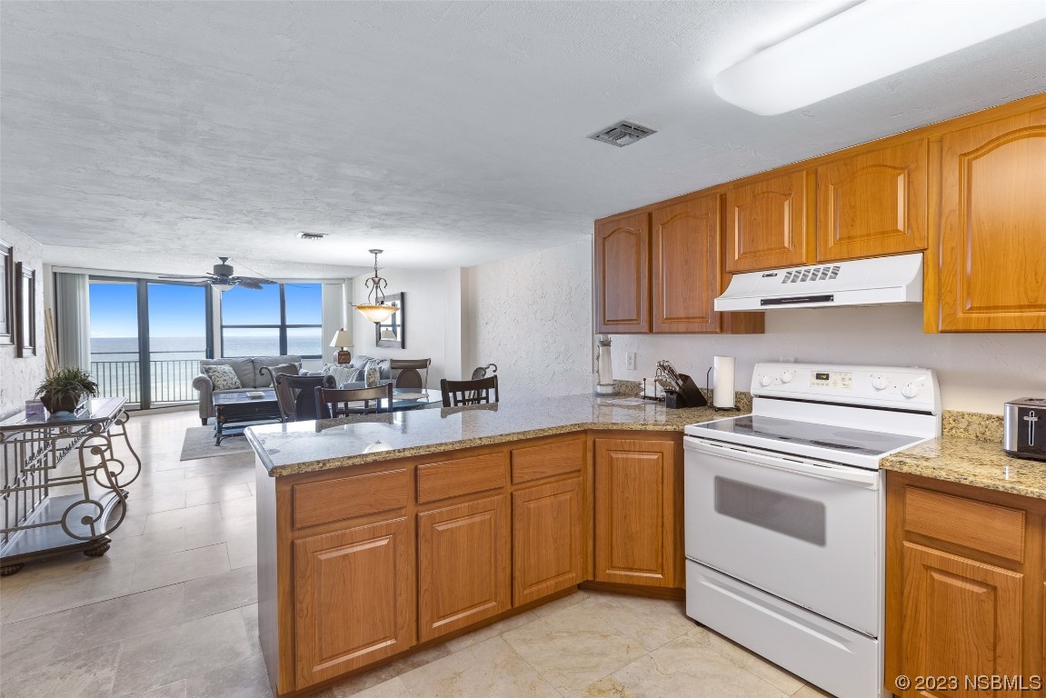 4745 South Atlantic Avenue, Unit 4030 Ponce Inlet, FL 32127 - Photo 20 of 47 a kitchen with sink cabinets and window