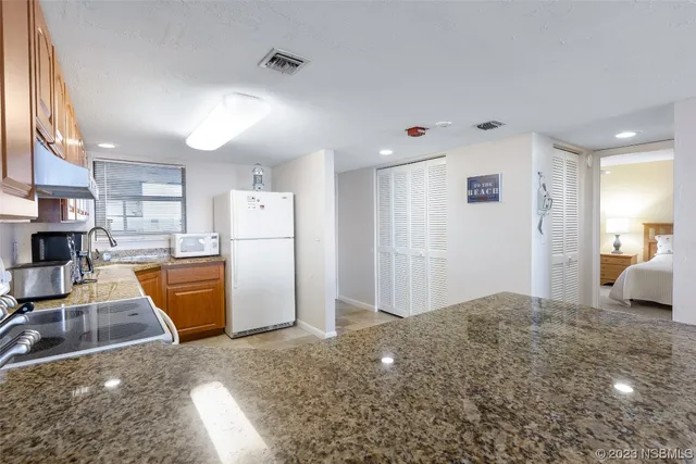 a view of kitchen and living room