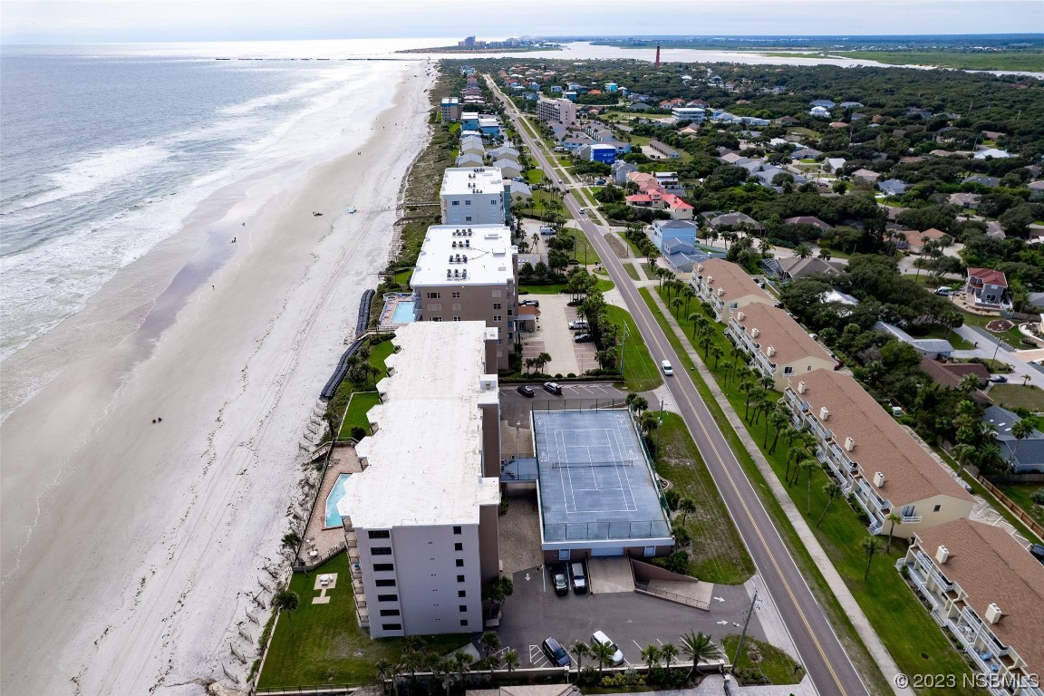 4745 South Atlantic Avenue, Unit 4030 Ponce Inlet, FL 32127 - Photo 23 of 47 an aerial view of residential houses with outdoor space