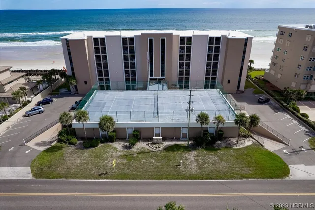 a aerial view of a house with a yard