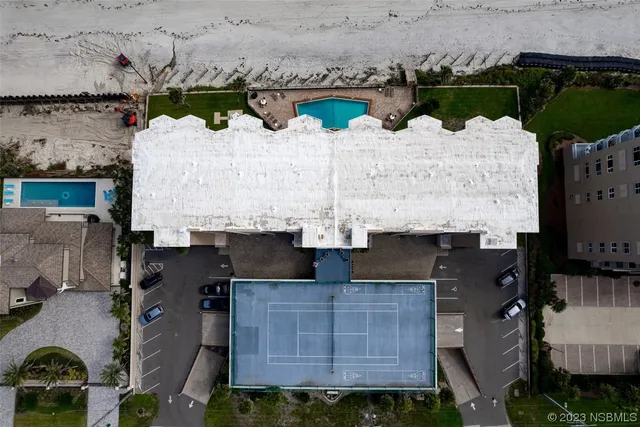 an aerial view of multiple houses with outdoor space