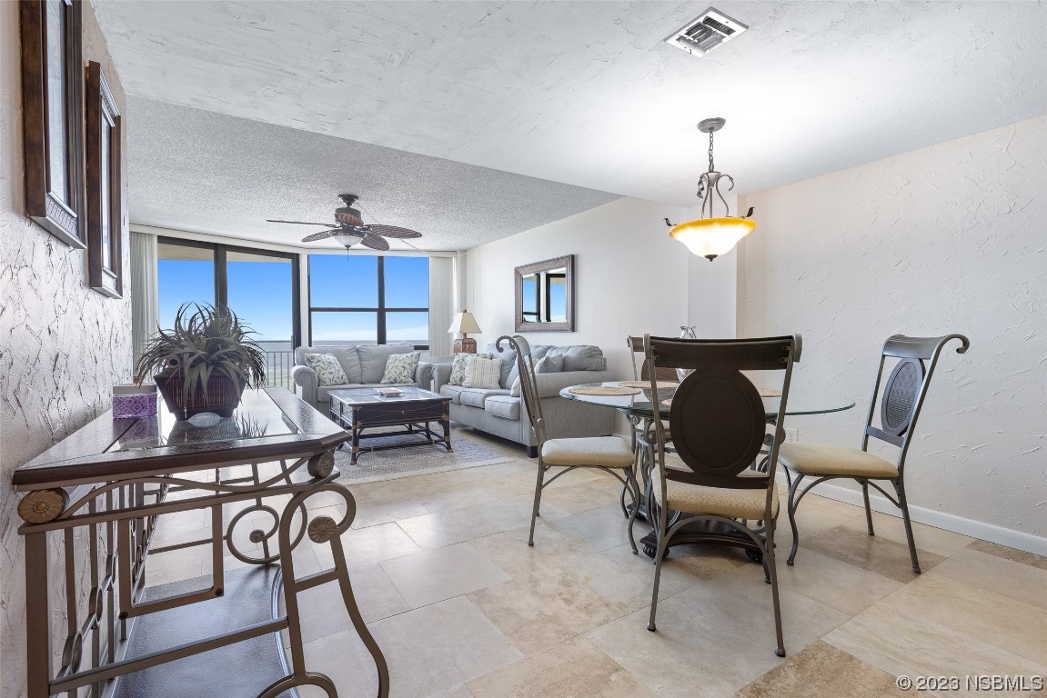 4745 South Atlantic Avenue, Unit 4030 Ponce Inlet, FL 32127 - Photo 3 of 47 a living room with furniture and wooden floor