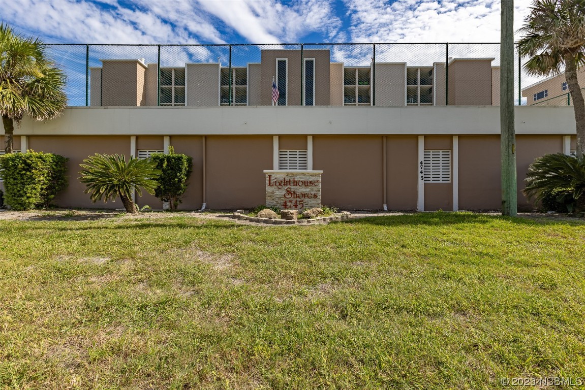 4745 South Atlantic Avenue, Unit 4030 Ponce Inlet, FL 32127 - Photo 33 of 47 a front view of a house with a yard