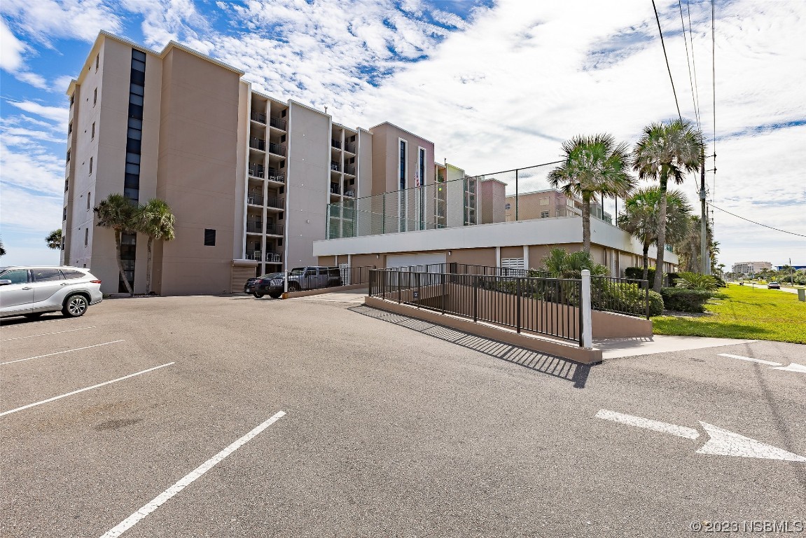4745 South Atlantic Avenue, Unit 4030 Ponce Inlet, FL 32127 - Photo 34 of 47 a view of a street with a building in the background