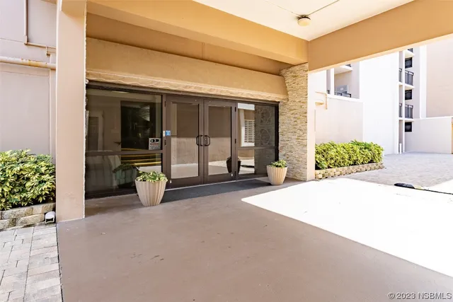 a view of a house with porch and furniture