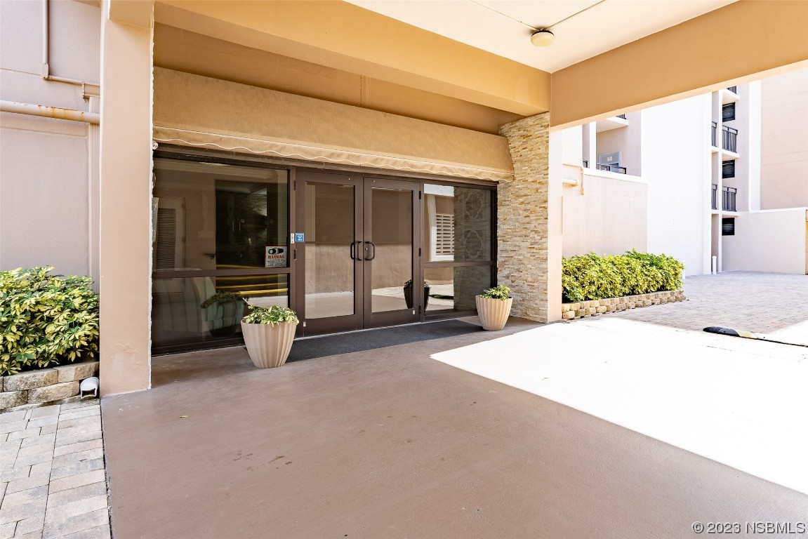 4745 South Atlantic Avenue, Unit 4030 Ponce Inlet, FL 32127 - Photo 35 of 47 a view of a house with porch and furniture