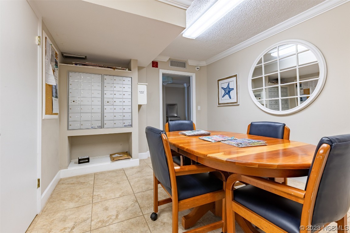 4745 South Atlantic Avenue, Unit 4030 Ponce Inlet, FL 32127 - Photo 38 of 47 a dining room with furniture and window