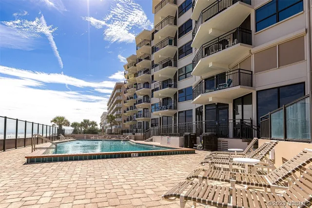 a view of swimming pool with a balcony