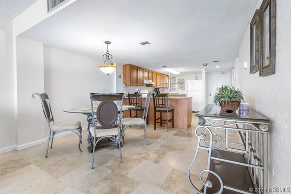 a view of a dining room with furniture