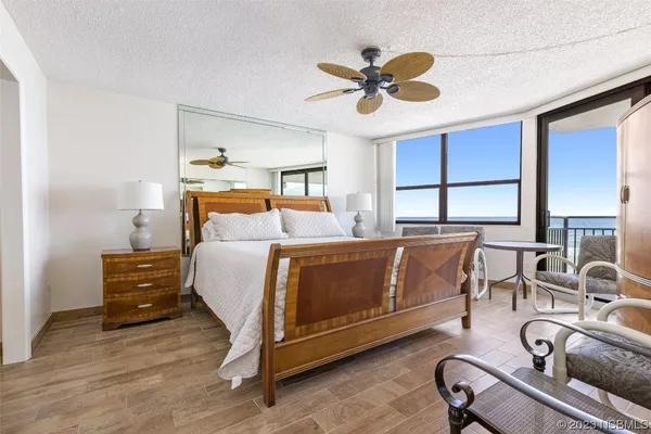 a bedroom with a bed window and couch