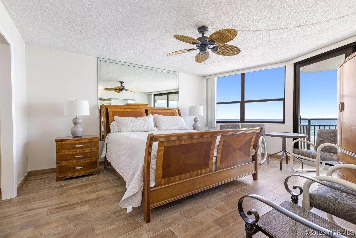 4745 South Atlantic Avenue, Unit 4030 Ponce Inlet, FL 32127 - Photo 9 of 47 a bedroom with a bed window and couch