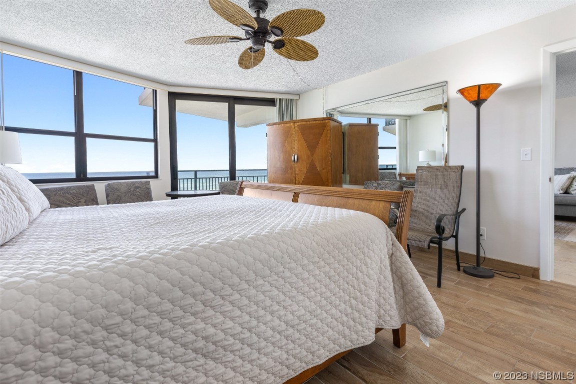 4745 South Atlantic Avenue, Unit 4030 Ponce Inlet, FL 32127 - Photo 10 of 47 a bedroom with a bed dresser and a window