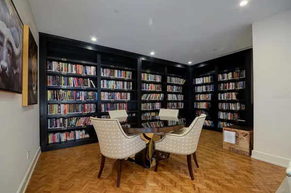 a view of a livingroom with furniture and staircase