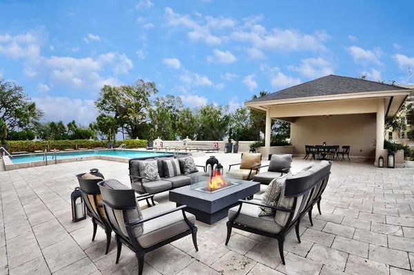 a terrace of a house with outdoor seating