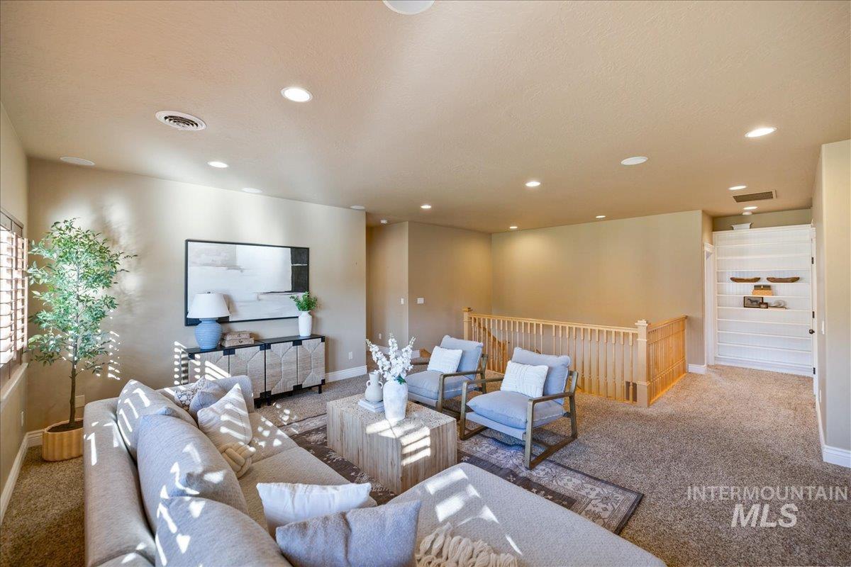 1479 West Oakhampton Drive Eagle, ID 83616 - Photo 20 of 49 Living area featuring carpet floors and recessed lighting