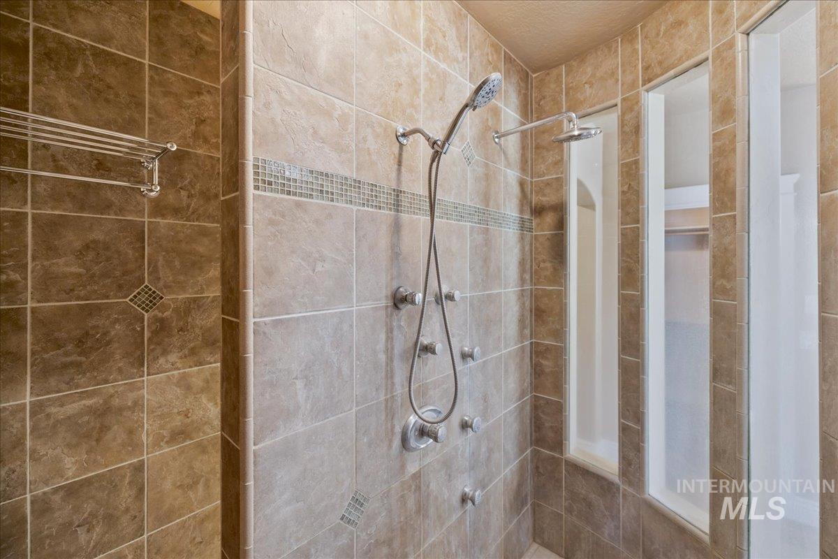 1479 West Oakhampton Drive Eagle, ID 83616 - Photo 28 of 49 Bathroom featuring a shower stall