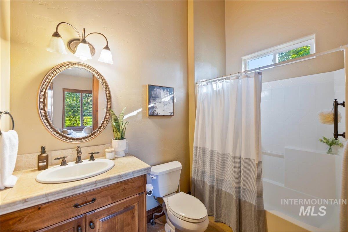 1479 West Oakhampton Drive Eagle, ID 83616 - Photo 39 of 49 Full bathroom featuring vanity and shower / bath combo with shower curtain