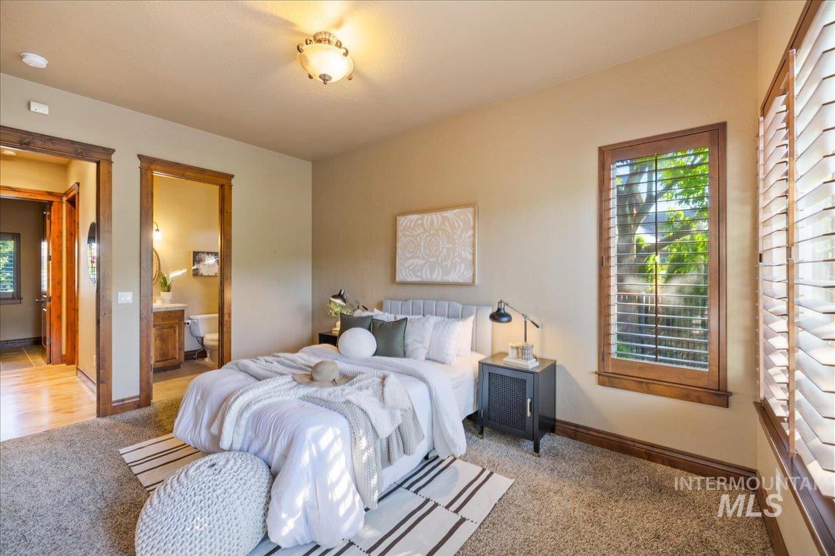 1479 West Oakhampton Drive Eagle, ID 83616 - Photo 40 of 49 Bedroom featuring carpet floors and ensuite bathroom