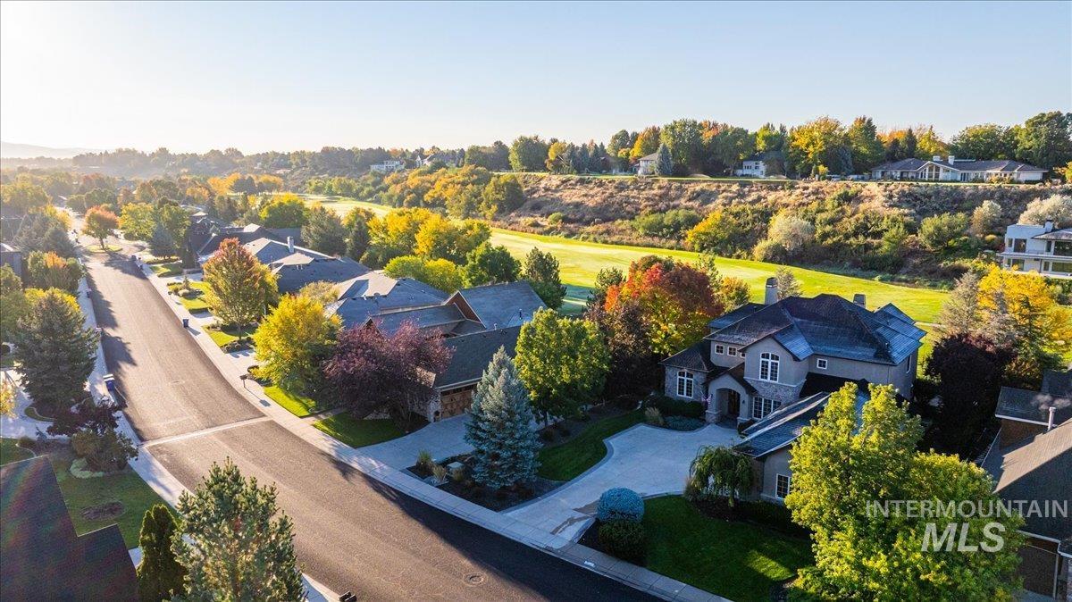 1479 West Oakhampton Drive Eagle, ID 83616 - Photo 5 of 49 Aerial view of residential area featuring a tree filled landscape