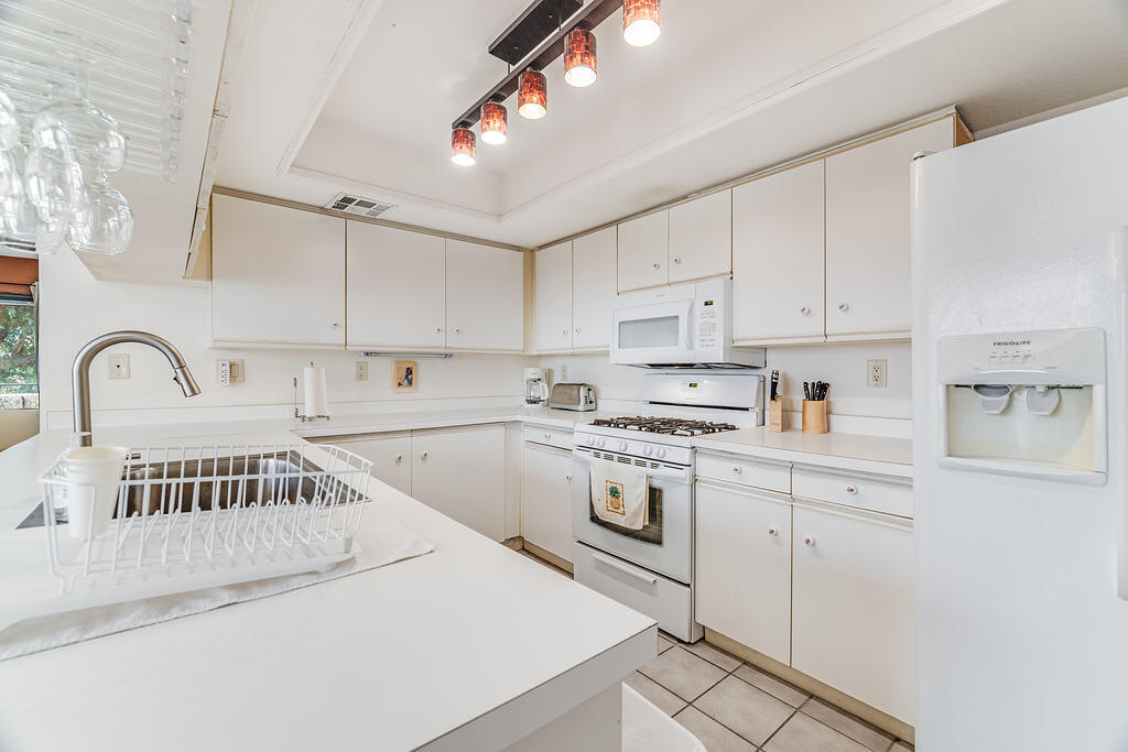 200 East Racquet Club Road, Unit 68 Palm Springs, CA 92262 - Photo 13 of 32 a view of a kitchen with sink and cabinets