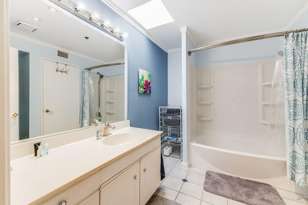 200 East Racquet Club Road, Unit 68 Palm Springs, CA 92262 - Photo 24 of 32 a bathroom with a tub sink and mirror