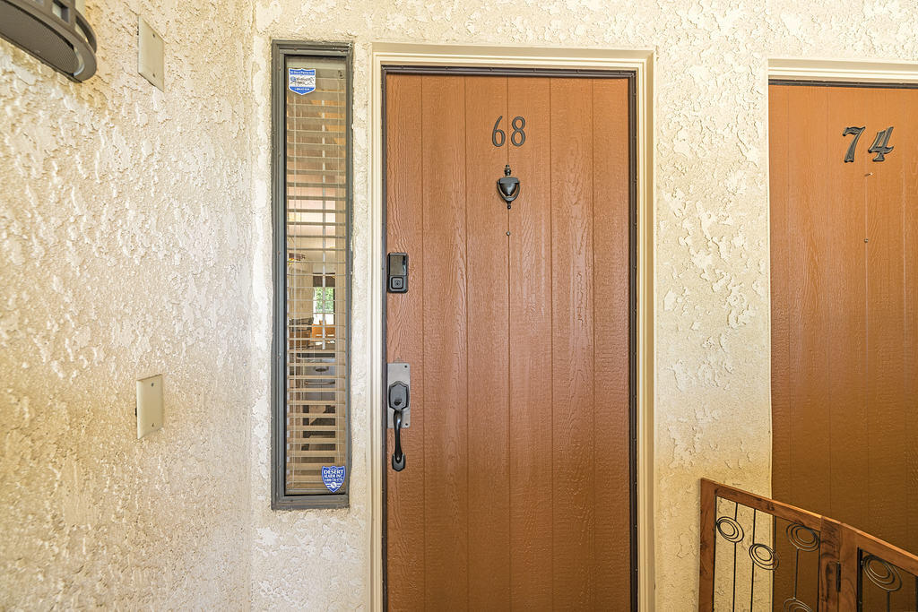 200 East Racquet Club Road, Unit 68 Palm Springs, CA 92262 - Photo 28 of 32 a door with a door