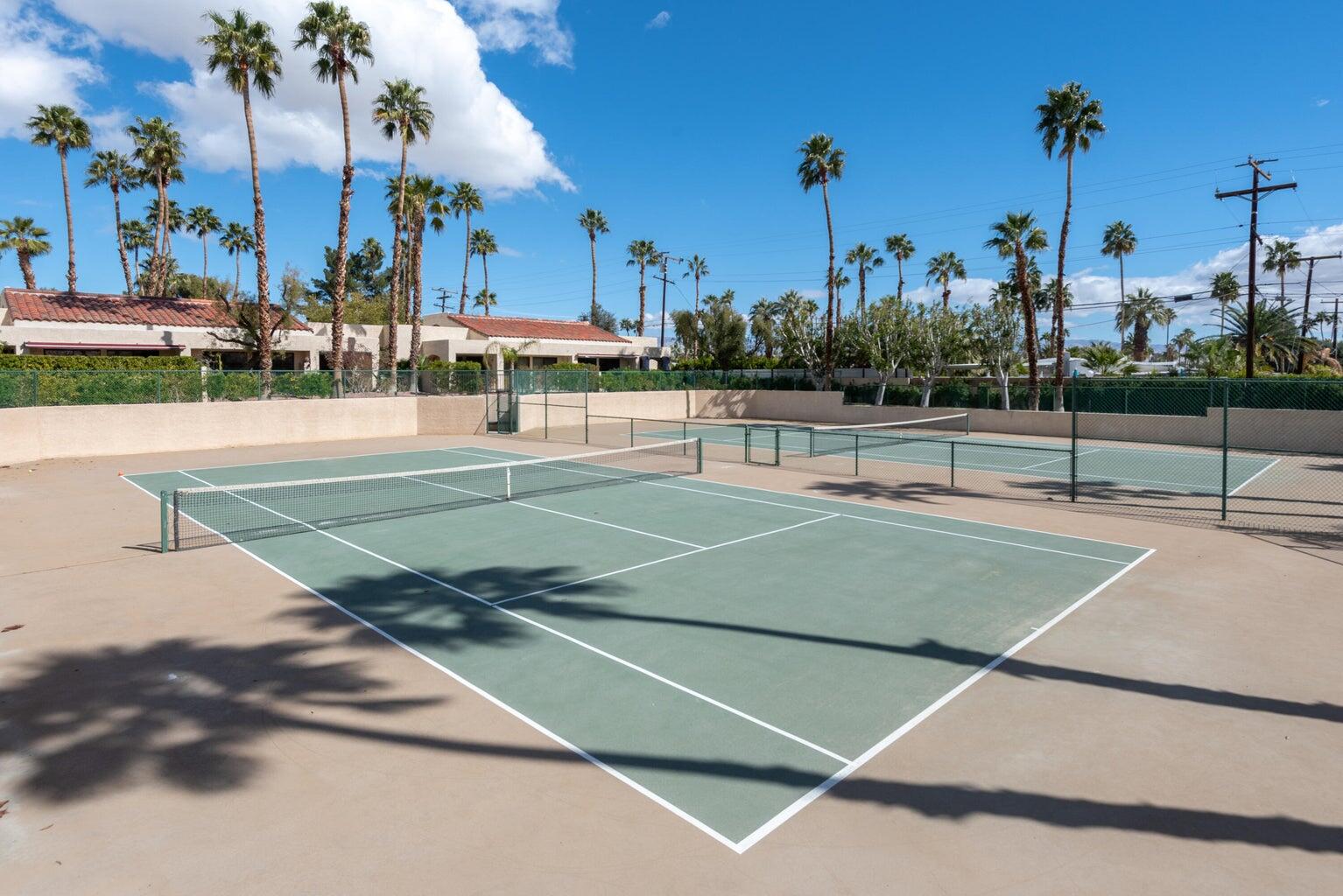 200 East Racquet Club Road, Unit 68 Palm Springs, CA 92262 - Photo 30 of 32 a view of a tennis court