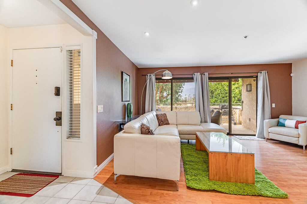 200 East Racquet Club Road, Unit 68 Palm Springs, CA 92262 - Photo 6 of 32 a living room with furniture and a window