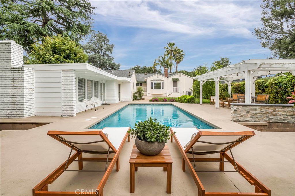 4553 Castle Road La Canada Flintridge, CA 91011 - Photo 1 of 1 a view of a house with backyard sitting area and garden