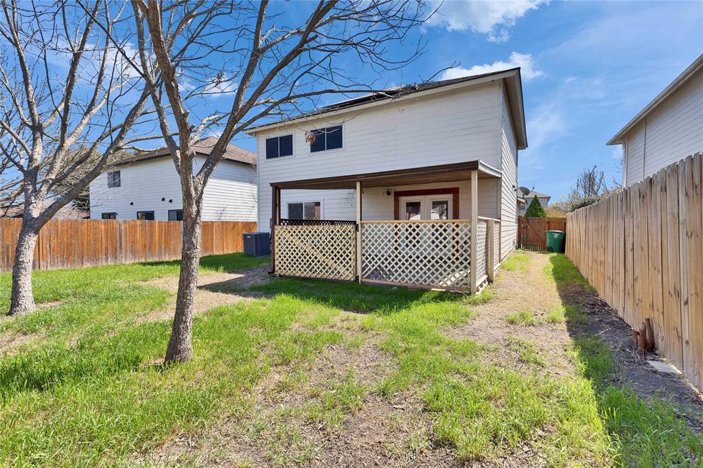 7504 Redrick Drive Austin, TX 78747 - Photo 30 of 34 The property features a fenced yard, a covered patio with lattice detailing, and exterior siding