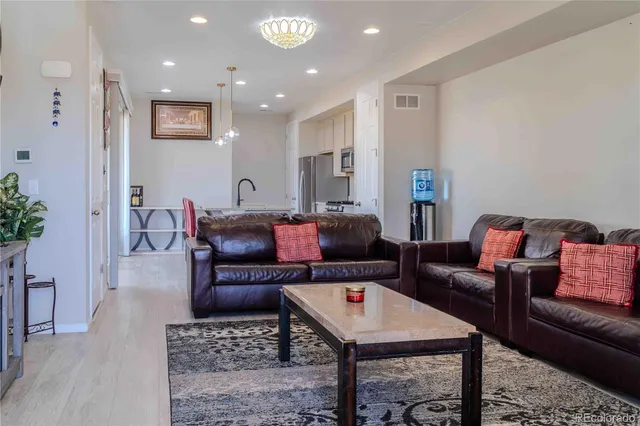 a living room with furniture and a table