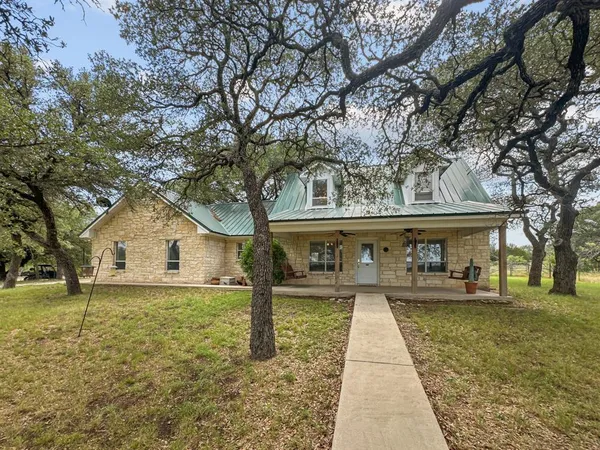 front view of a house with a yard