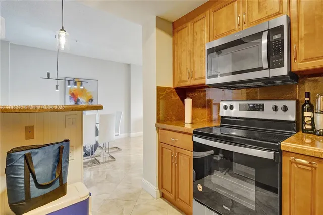 a kitchen with a stove and a microwave