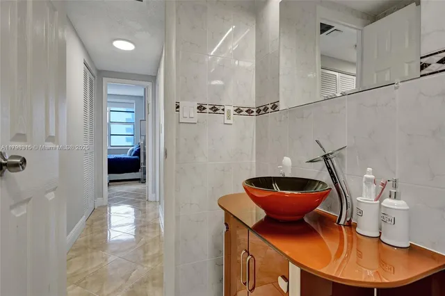 a view of a hallway with furniture and front door