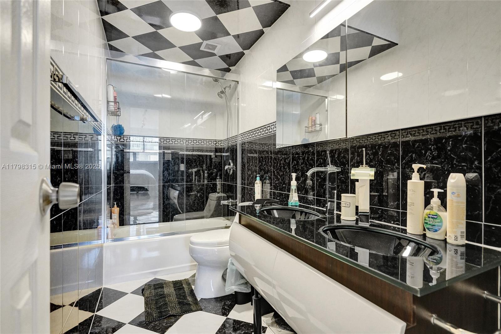 1980 South Ocean Drive, Unit 7J Hallandale Beach, FL 33009 - Photo 22 of 33 a room with lots of bottles of alcohol