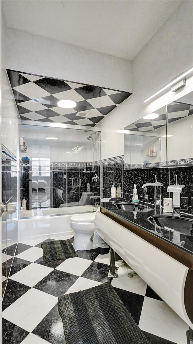 1980 South Ocean Drive, Unit 7J Hallandale Beach, FL 33009 - Photo 23 of 33 a kitchen with a sink and a stove