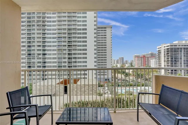 a living room with furniture a rug and a window