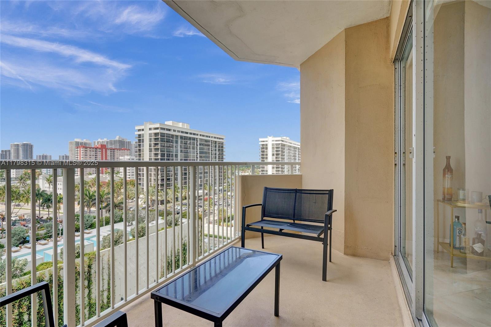1980 South Ocean Drive, Unit 7J Hallandale Beach, FL 33009 - Photo 26 of 33 a living room with furniture a rug and a window