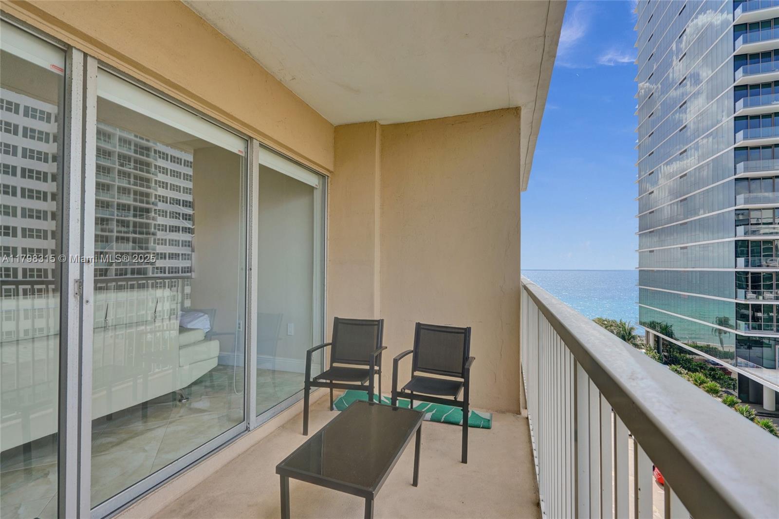 1980 South Ocean Drive, Unit 7J Hallandale Beach, FL 33009 - Photo 30 of 33 a balcony with chairs and table