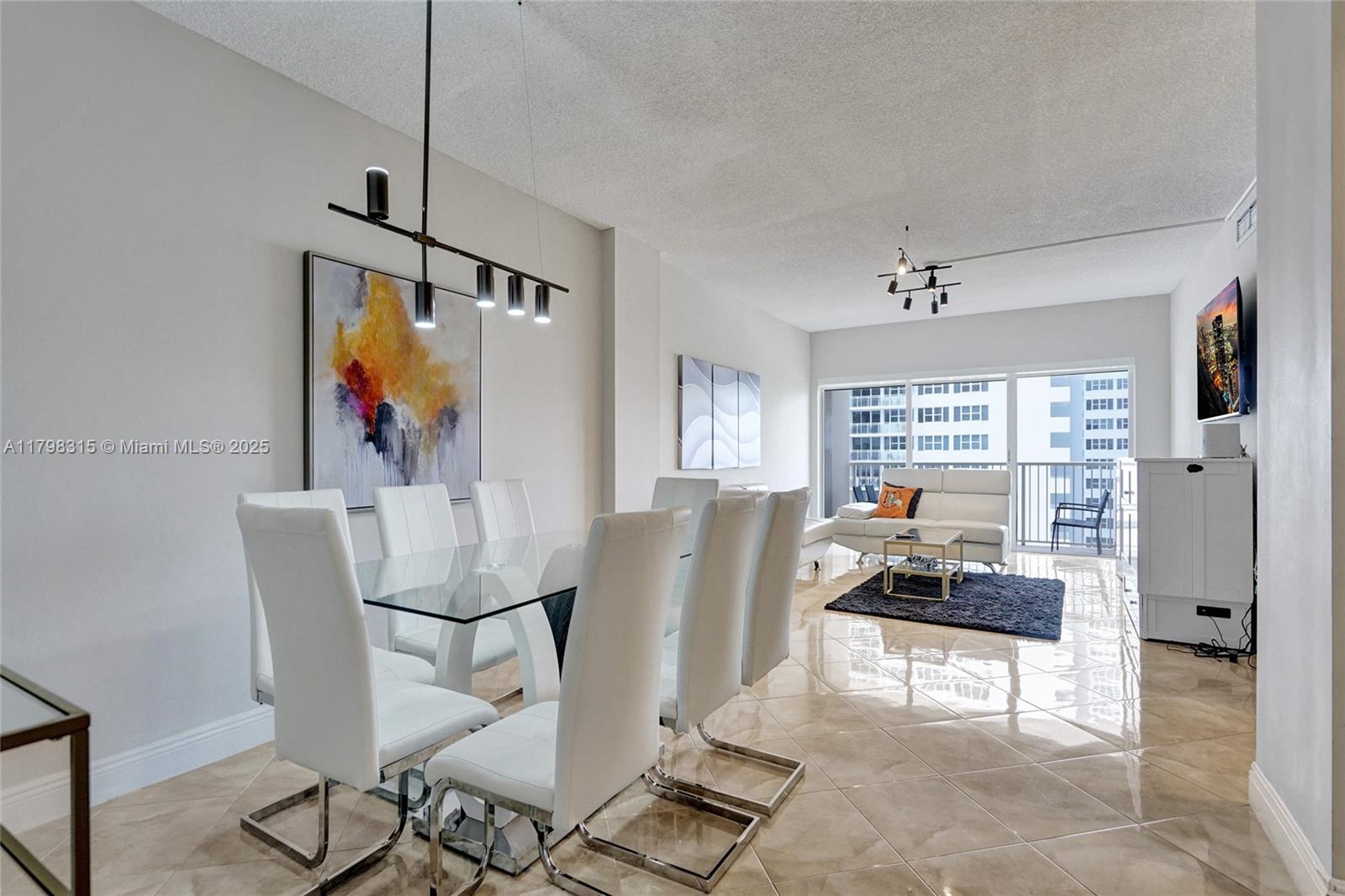 1980 South Ocean Drive, Unit 7J Hallandale Beach, FL 33009 - Photo 4 of 33 a view of a livingroom with furniture and a window