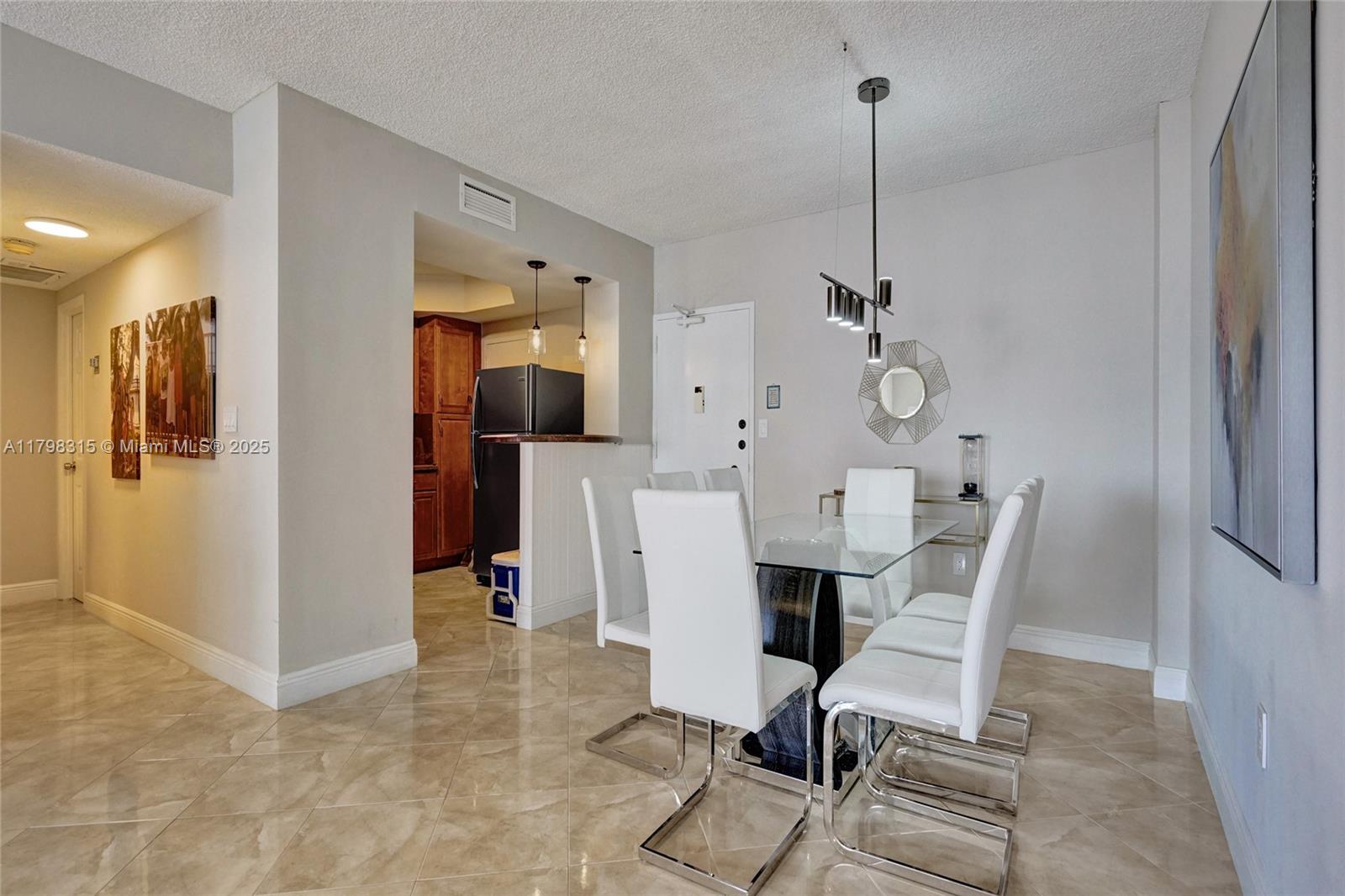 1980 South Ocean Drive, Unit 7J Hallandale Beach, FL 33009 - Photo 6 of 33 a view of a dining room with furniture