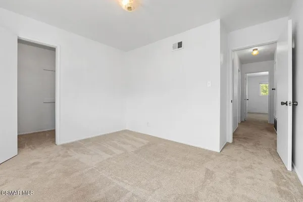 an empty room with a bathroom