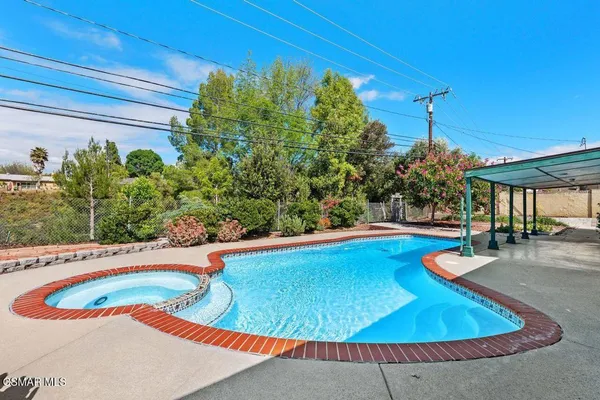 a view of a swimming pool with an outdoor space