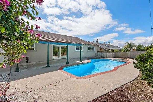 a view of pool with outdoor seating