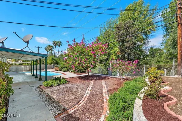 a view of yard with patio