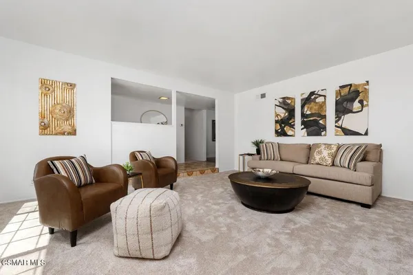 a living room with furniture and a couch