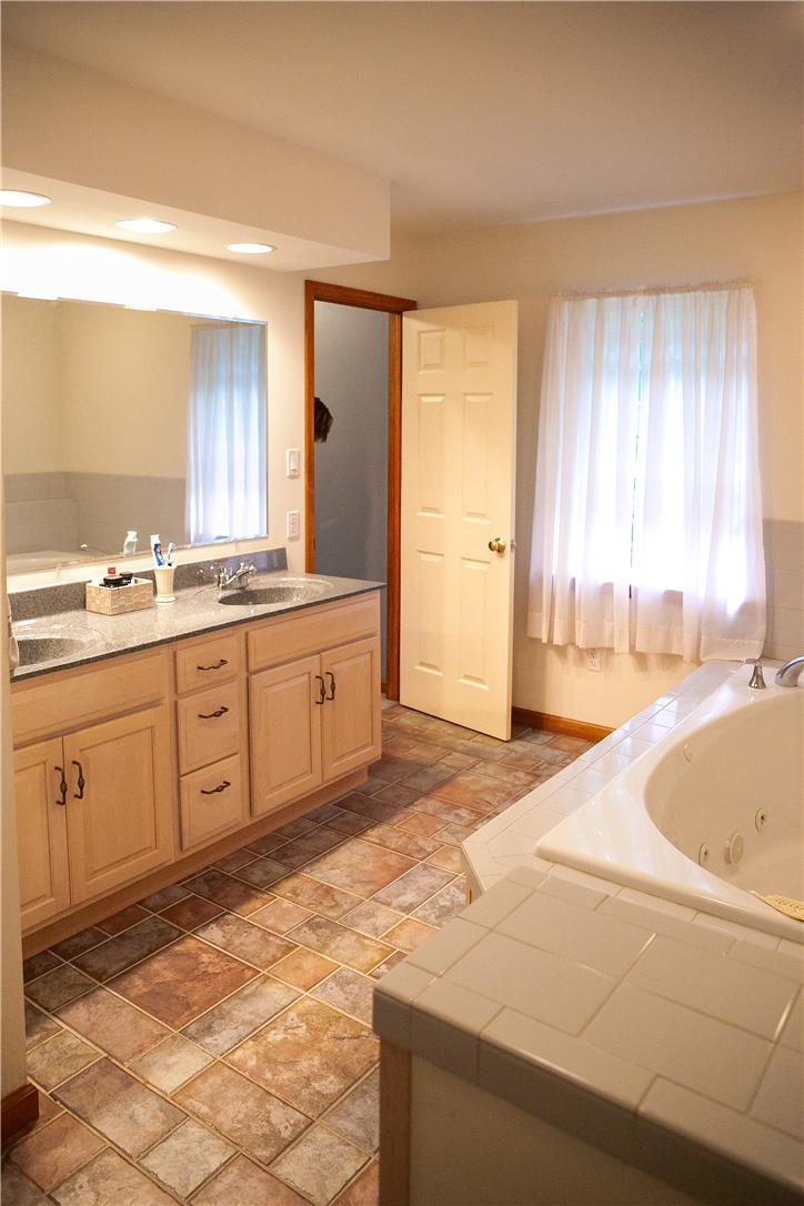 50 Anthony's Road White Haven, PA 18661 - Photo 42 of 57 a spacious bathroom with a tub sink and mirror