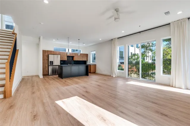 a view of kitchen with furniture and wooden floor